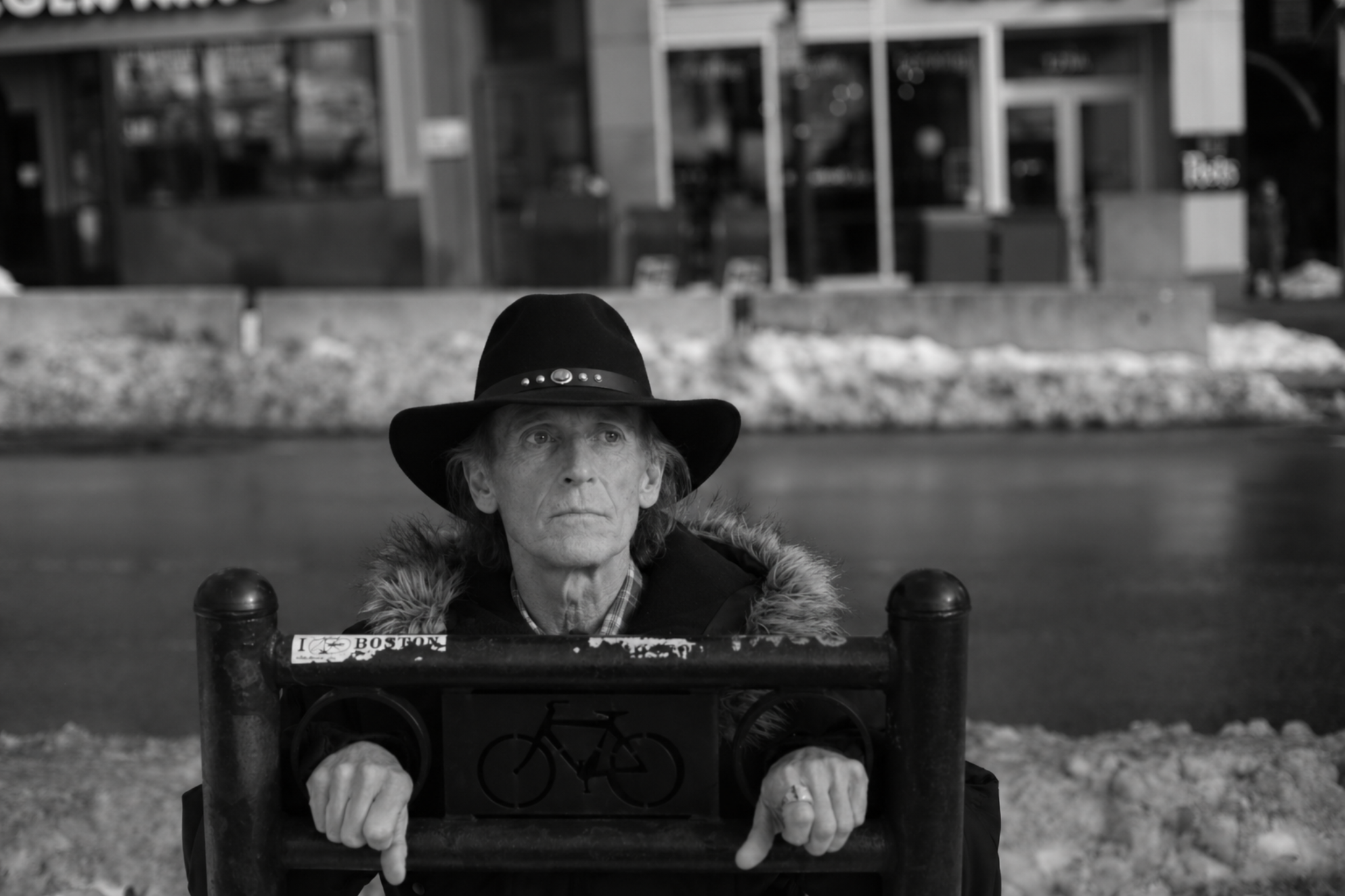 Silas Crowe outside in winter, black hat and Southern gothic mood